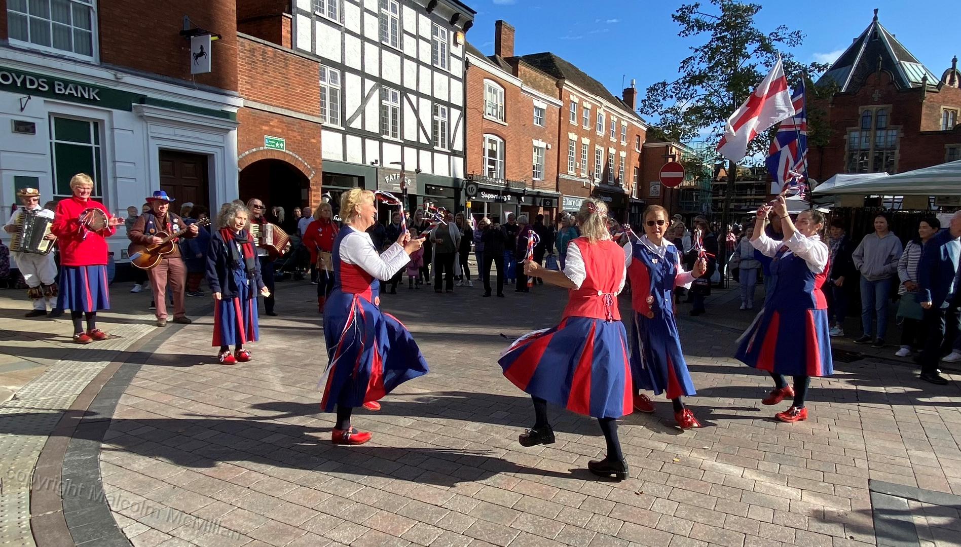 dancing in the Market square in front of an appreciative crowd